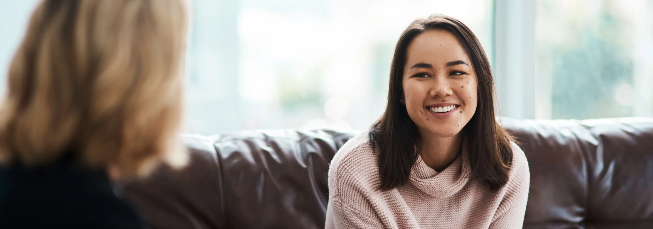 Woman smiling when receiving mental health care in the home.