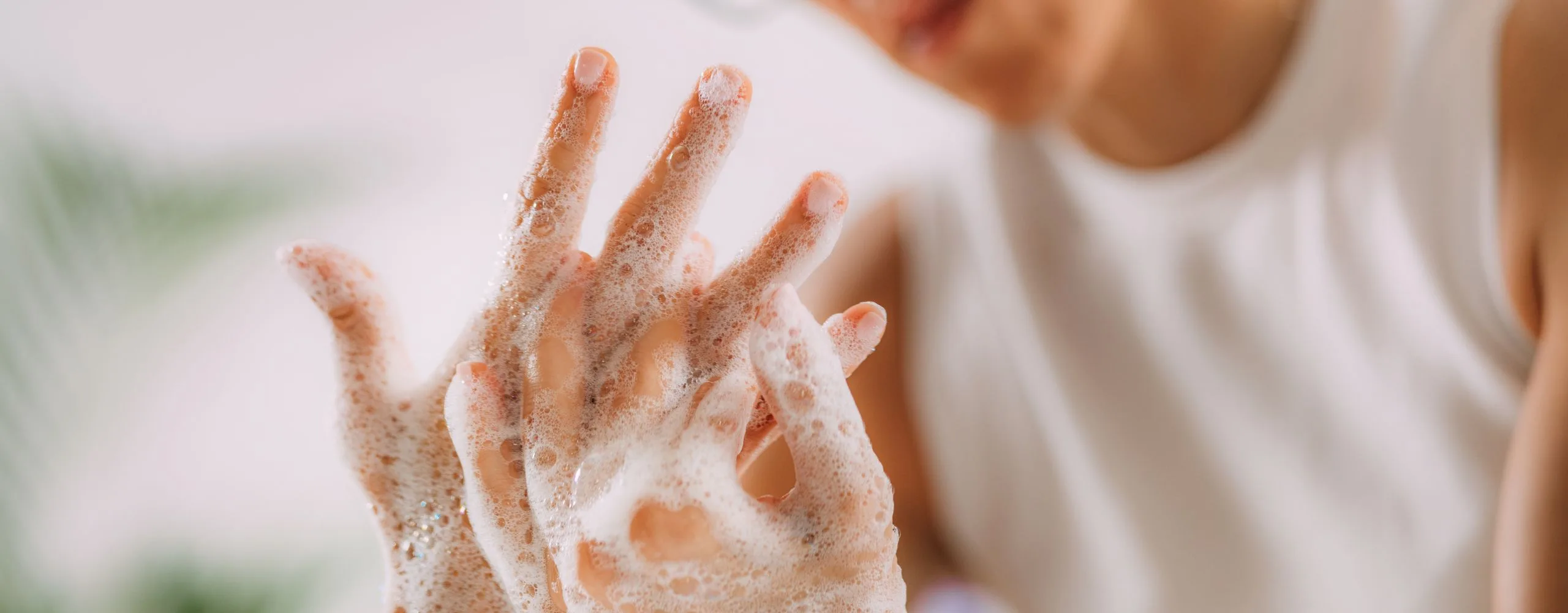 Woman with OCD and BDD washing their hands